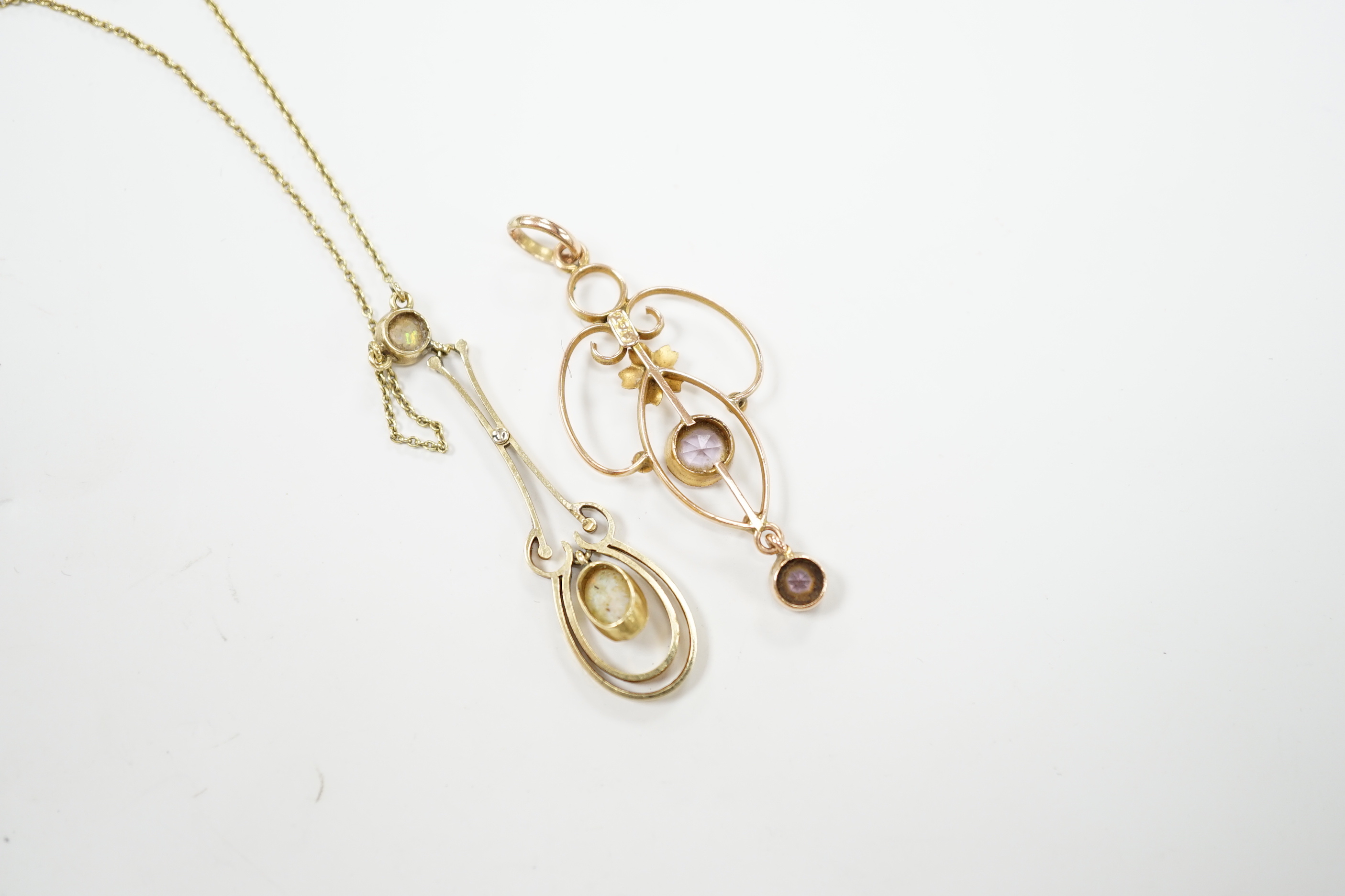 An Edwardian 15ct and two stone white opal set drop pendant necklace, chain unmarked, overall 46cm, and one other Edwardian 9ct and gem set pendant, 40mm.